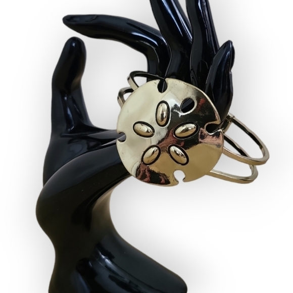 Sand Dollar Goldtone Hinged Cuff Bracelet - Picture 3 of 9